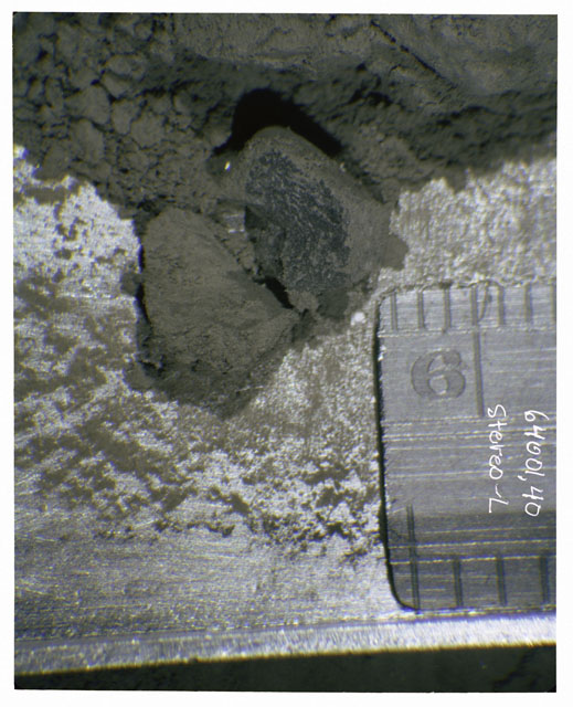 Color photograph of Apollo 16 Core Sample 64001,40; Left Stereo photograph displaying in situ Core Fines .