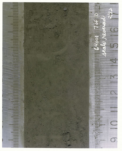Color photograph of Apollo 16 Core Sample(s) 64001,1; 7 of 10 Processing photograph of displaying Core with scale reversed.