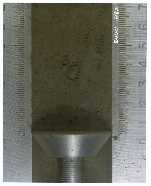 Color photograph of Apollo 16 Core Sample(s) 64001,1; Processing photograph of displaying Core with .