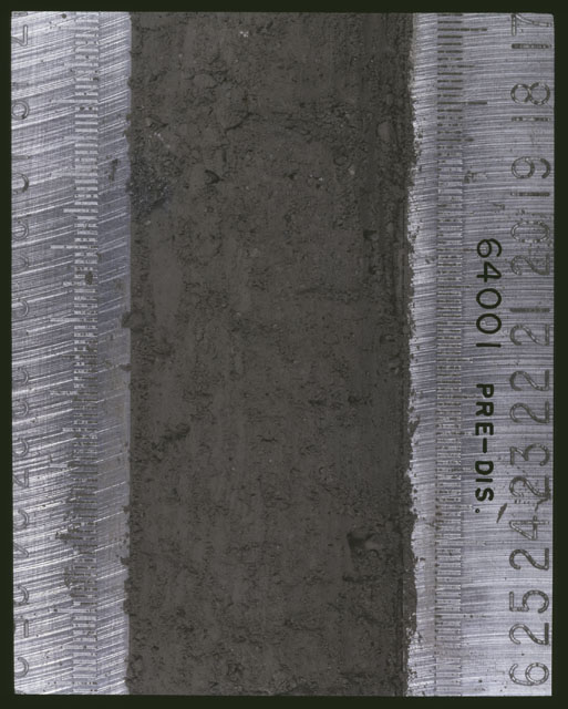 Color photograph of Apollo 16 Sample(s) 64001; 5 of 11 Processing photograph displaying pre-dissection Core at 17-26 cm depth.