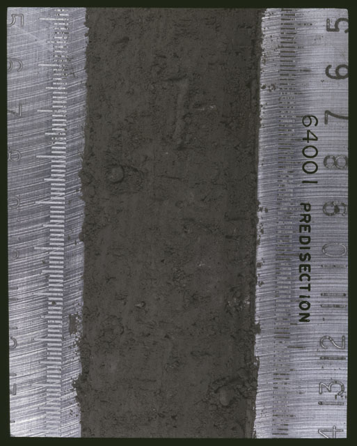 Color photograph of Apollo 16 Sample(s) 64001; 8 of 11 Processing photograph displaying pre-dissection Core at 5-14 cm depth.