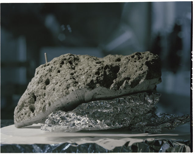 Color photograph of Apollo 17 Sample(s) 76015,19; Processing photograph displaying sawed surface.