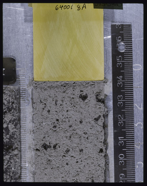 Color photograph of Apollo 16 Core Sample(s) 64001; Processing photograph displaying Core after peel with clod 8A.