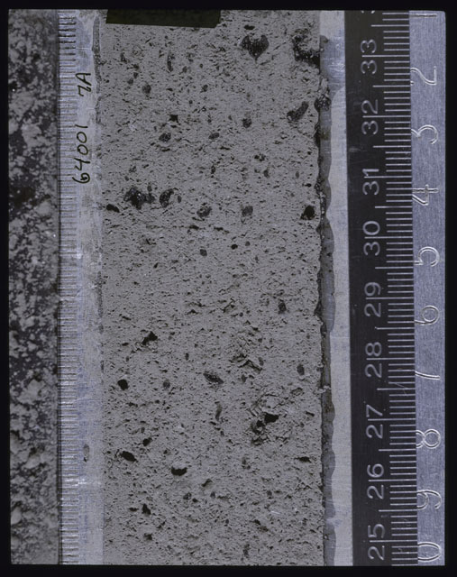 Color photograph of Apollo 16 Core Sample(s) 64001; Processing photograph displaying Core after peel with clod 7A.