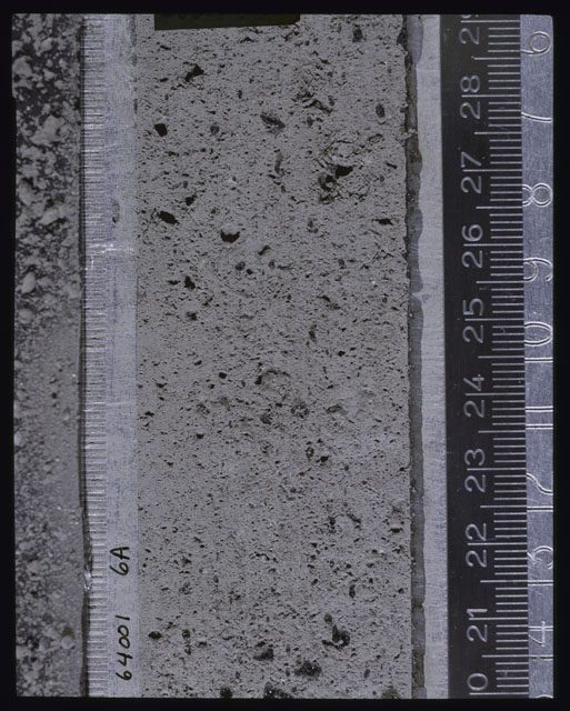 Color photograph of Apollo 16 Core Sample(s) 64001; Processing photograph displaying Core after peel with clod 6A.