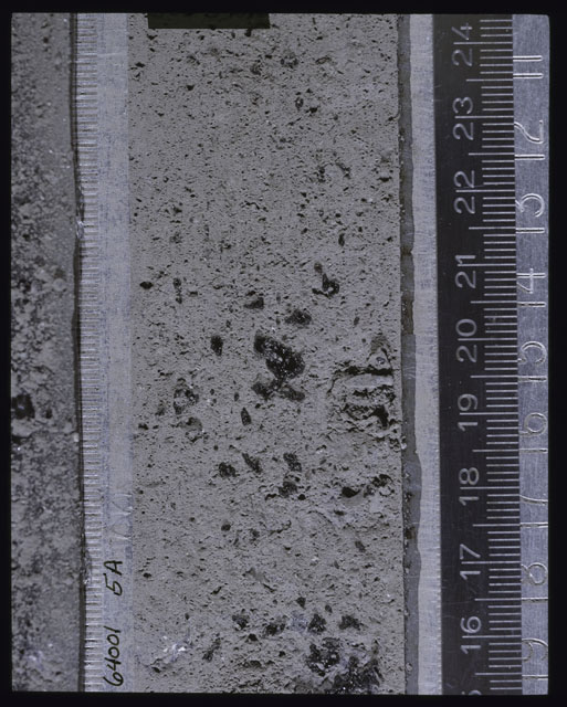 Color photograph of Apollo 16 Core Sample(s) 64001; Processing photograph displaying Core after peel with clod 5A.