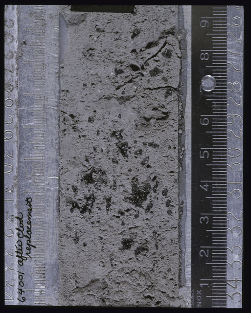 Color photograph of Apollo 16 Core Sample(s) 64001; Processing photograph displaying Core after clod replacement.