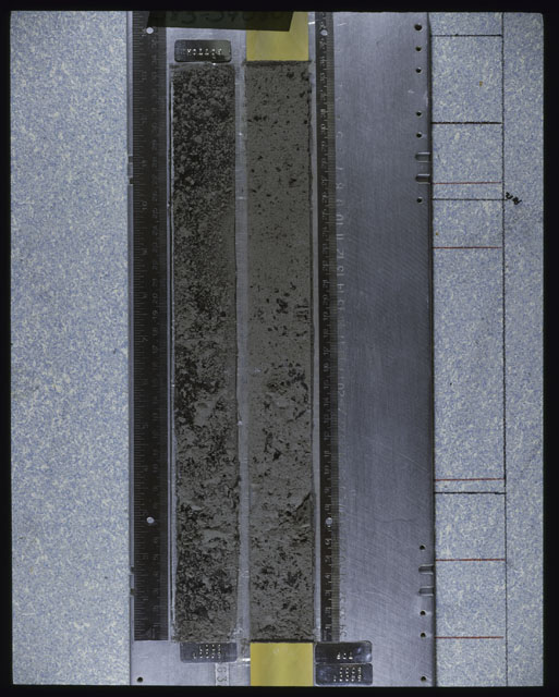 Color photograph of Apollo 16 Core Sample(s) 64001; Processing photograph displaying an overview of a Core with peel.