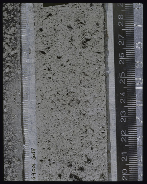 Color photograph of Apollo 16 Sample(s) 64001; 6 of 8 Processing photograph displaying post peel Core at 20-29 cm depth.