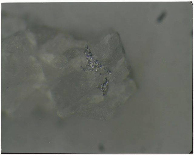 Color photograph of Apollo 14 Sample(s) 14304; Processing photograph displaying metal grains.