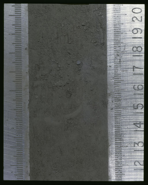 Color photograph of Apollo 16 Sample(s) 64001,1; Processing photograph displaying Core at 11.5-20.5 cm depth.