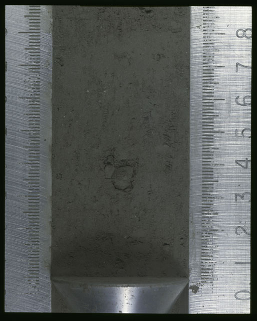 Color photograph of Apollo 16 Sample(s) 64001,1; Processing photograph displaying Core at 0-8.5 cm depth.