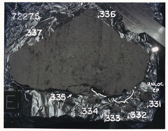 Color photograph of Apollo 17 Sample(s)72275,331-336; Processing photograph displaying slab reconstruction with an orientation of E.