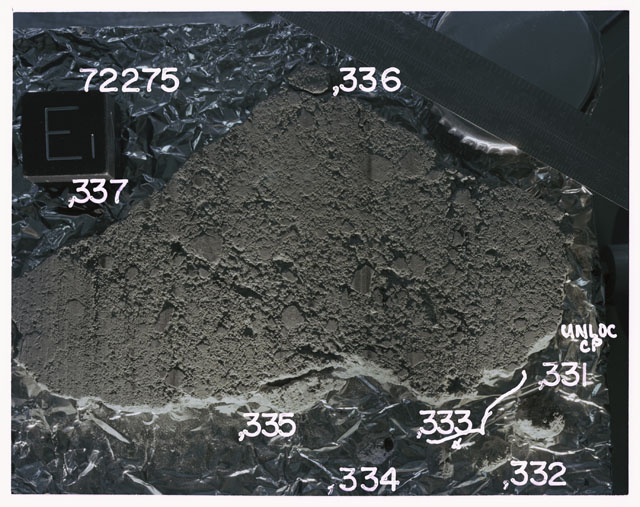 Color photograph of Apollo 17 Sample(s)72275,331-337; Processing photograph displaying slab reconstruction with an orientation of E.