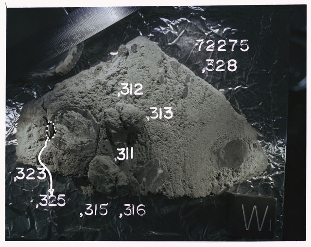 Color photograph of Apollo 17 Sample(s)72275,311-313,315,316,323,325,328; Processing photograph displaying slab reconstruction with an orientation of W.