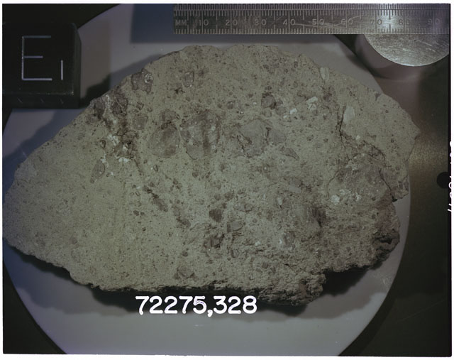 Color photograph of Apollo 17 Sample(s)72275,328; Processing photograph displaying slab with an orientation of E.