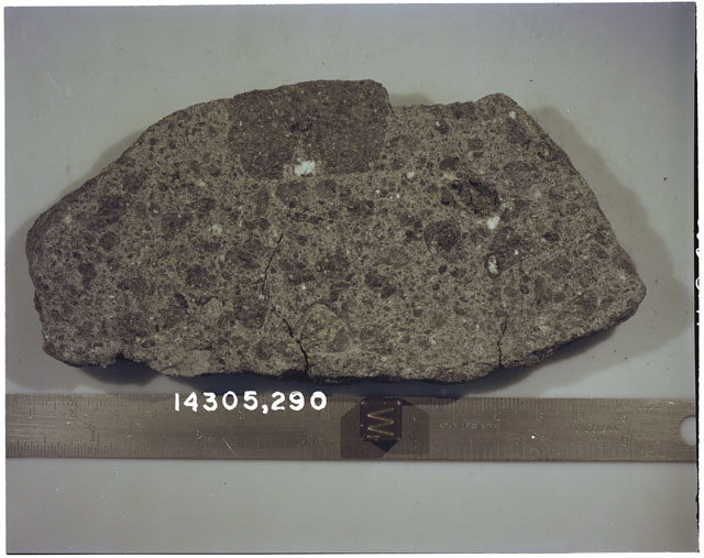 Color photograph of Apollo 14 Sample(s) 14305,290; Processing photograph displaying a slab with an orientation of W.