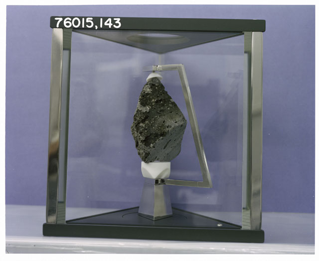 Color Processing photograph of Apollo 17 Sample(s) 76015,143 in a display case.