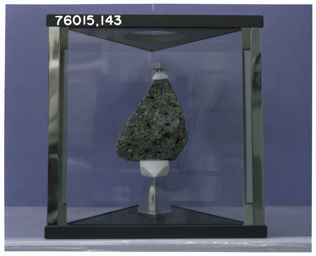 Color Processing photograph of Apollo 17 Sample(s) 76015,143 in a display case.