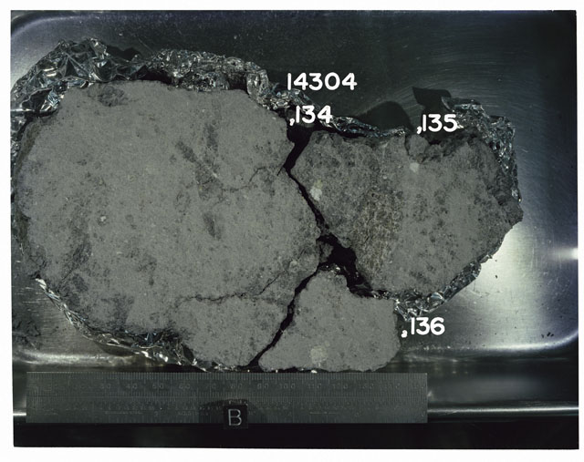 Color photograph of Apollo 14 Sample(s) 14304,134-136; Processing photograph displaying a slab reconstruction with an orientation of B.