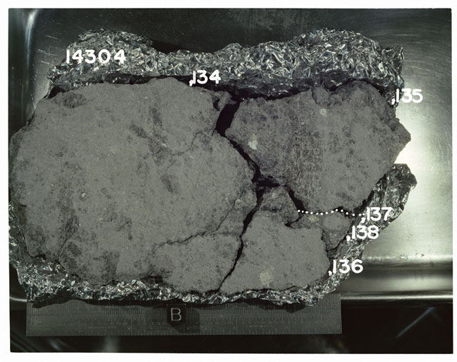 Color photograph of Apollo 14 Sample(s) 14304,134-138; Processing photograph displaying a slab reconstruction with an orientation of B.