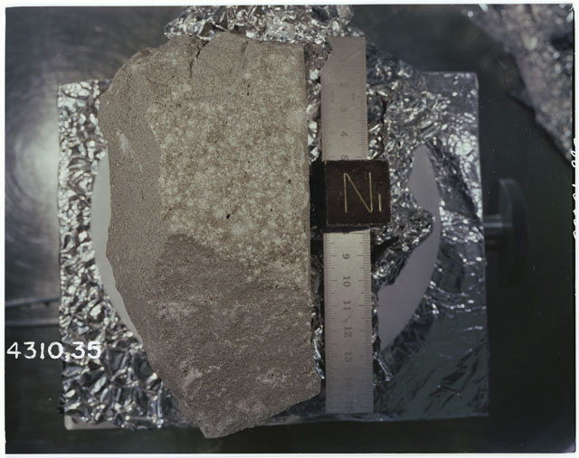Color photograph of Apollo 14 Sample(s) 14310,35; Processing photograph displaying an orientation of N.