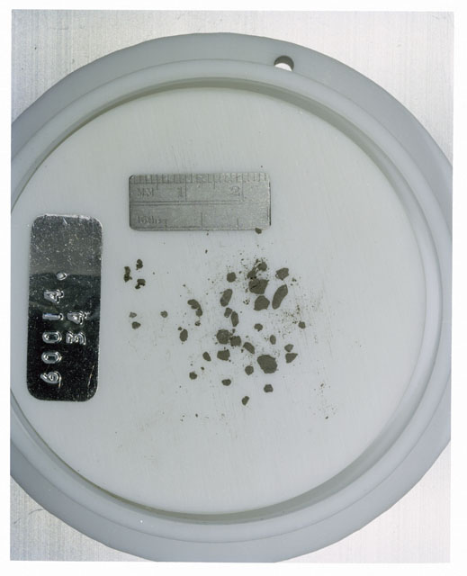 Color photograph of Apollo 16 Core Sample 60014,34; Processing photograph displaying >1 MM Core Fines .