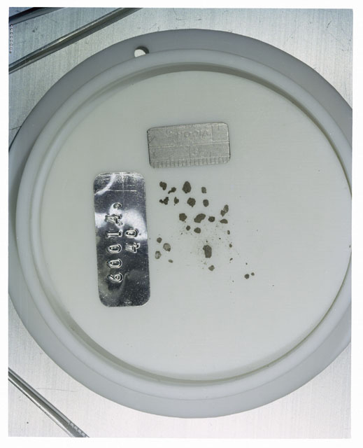 Color photograph of Apollo 16 Core Sample 60014,40; Processing photograph displaying >1 MM Core Fines .