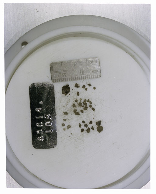 Color photograph of Apollo 16 Core Sample 60014,105; Processing photograph displaying >1 MM Core Fines .