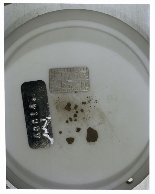 Color photograph of Apollo 16 Core Sample 60014,101; Processing photograph displaying >1 MM Core Fines .