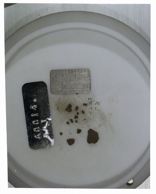 Color photograph of Apollo 16 Core Sample 60014; Processing photograph displaying >1 MM Core Fines .