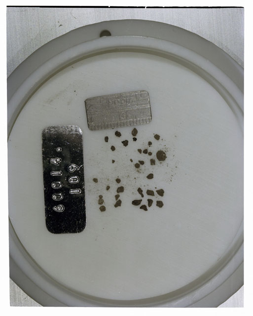 Color photograph of Apollo 16 Core Sample 60014,109; Processing photograph displaying >1 MM Core Fines .