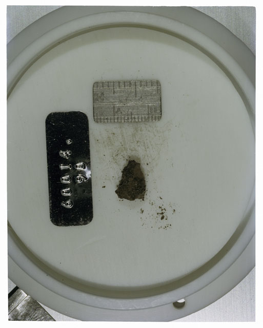 Color photograph of Apollo 16 Core Sample 60014,90; Processing photograph displaying >1 MM Core Fines .
