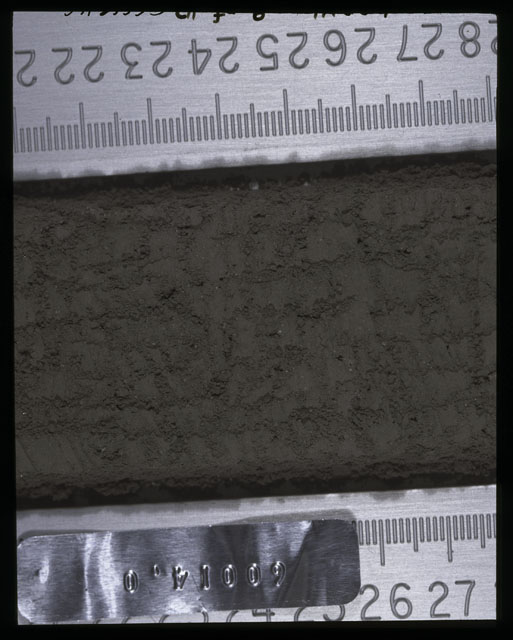 Color photograph of Apollo 16 Sample(s) 60014,0; 9 of 10 Processing photograph displaying after 1st dissection and derinding Core Tube at 21-28 cm depth.
