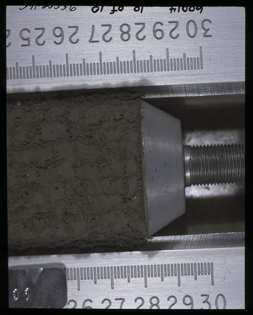 Color photograph of Apollo 16 Sample(s) 60014,0; 10 of 10 Processing photograph displaying after 1st dissection and derinding Core Tube at 24-30 cm depth.