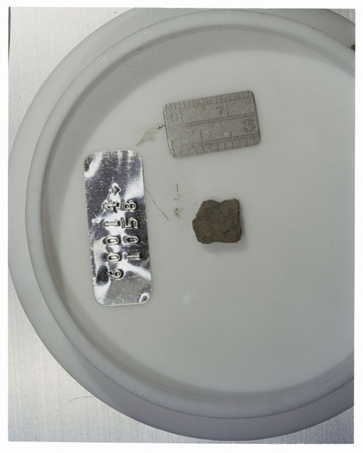 Color photograph of Apollo 16 Core Sample 60014,1058; Processing photograph displaying >1 MM Core Fines .