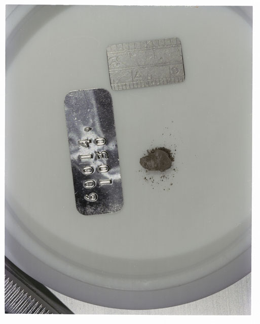 Color photograph of Apollo 16 Core Sample 60014,1030; Processing photograph displaying >1 MM Core Fines .