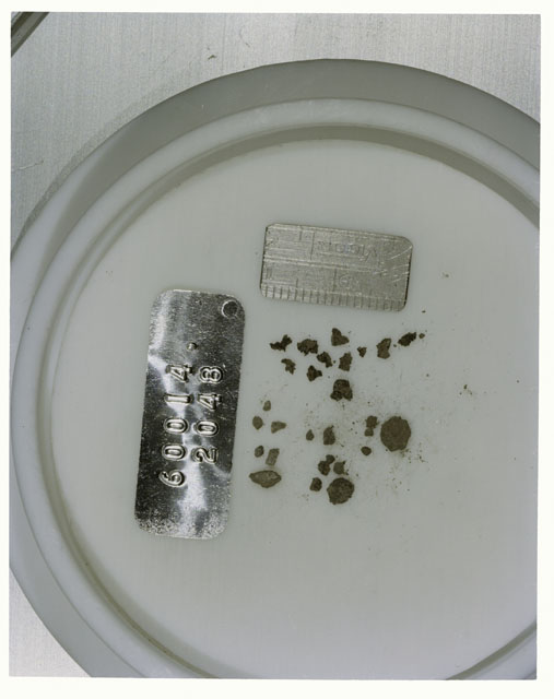Color photograph of Apollo 16 Core Sample 60014,2048; Processing photograph displaying >1 MM Core Fines .