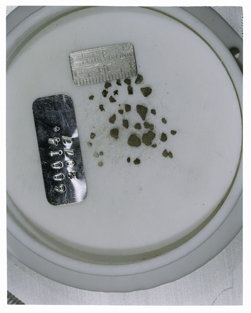 Color photograph of Apollo 16 Core Sample 60014,2077; Processing photograph displaying >1 MM Core Fines .