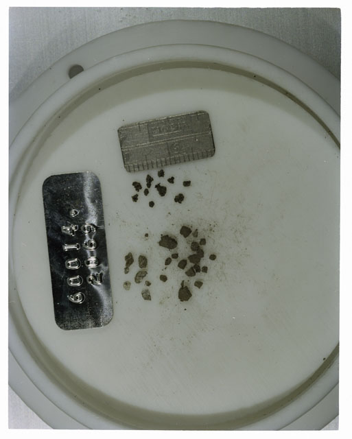 Color photograph of Apollo 16 Core Sample 60014,2069; Processing photograph displaying >1 MM Core Fines .