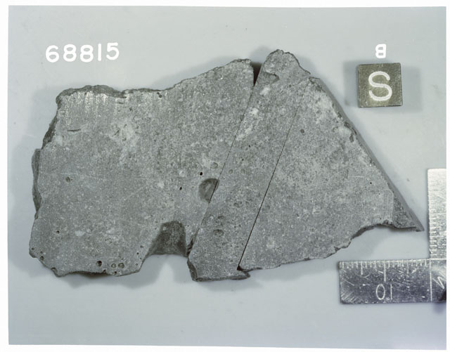 Color photograph of Apollo 16 Sample(s) 68815; Processing photograph displaying reconstruction with an slab of S,B.