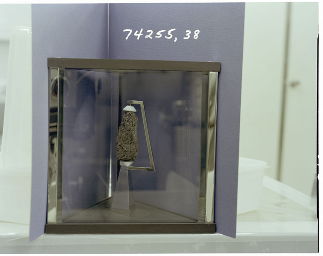 Color Processing photograph of Apollo 17 Sample(s) 74255,38 in a display case.