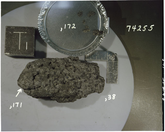 Color photograph of Apollo 17 Sample(s) 74255,38,171,172; Processing photograph displaying chips and fines reconstruction with an orientation of T.