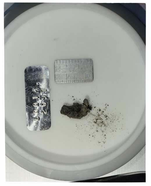 Color photograph of Apollo 16 Core Sample 60014,2097; Processing photograph displaying >1 MM Core Fines .