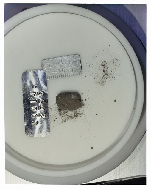 Color photograph of Apollo 16 Core Sample 60014,2096; Processing photograph displaying >1 MM Core Fines .