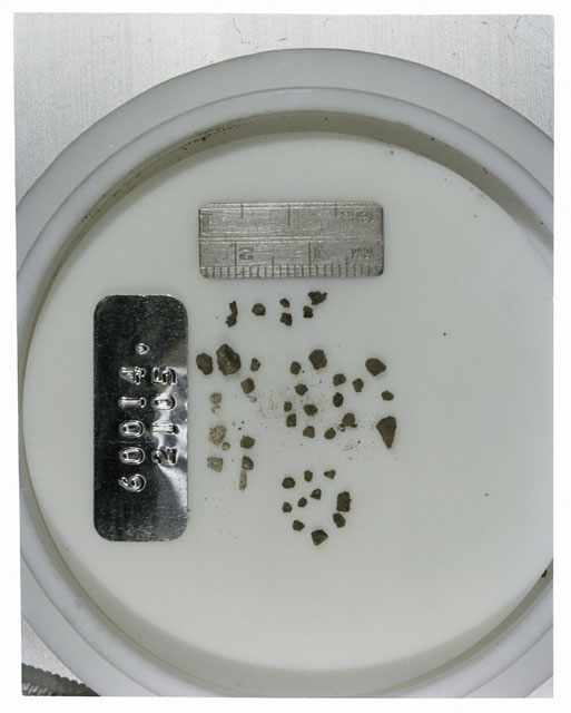 Color photograph of Apollo 16 Core Sample 60014,2105; Processing photograph displaying >1 MM Core Fines .