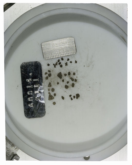 Color photograph of Apollo 16 Core Sample 60014,2111; Processing photograph displaying >1 MM Core Fines .