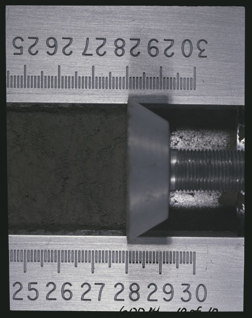 Color photograph of Apollo 16 Sample(s) 60014,0; 10 of 10 Processing photograph displaying after 3rd dissection Core Tube at 24-30 cm depth.