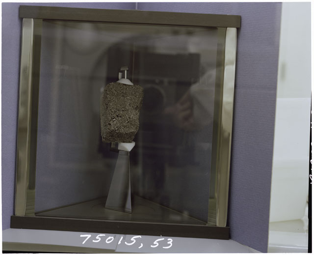 Color Processing photograph of Apollo 17 Sample(s) 75015,53 in a display case.