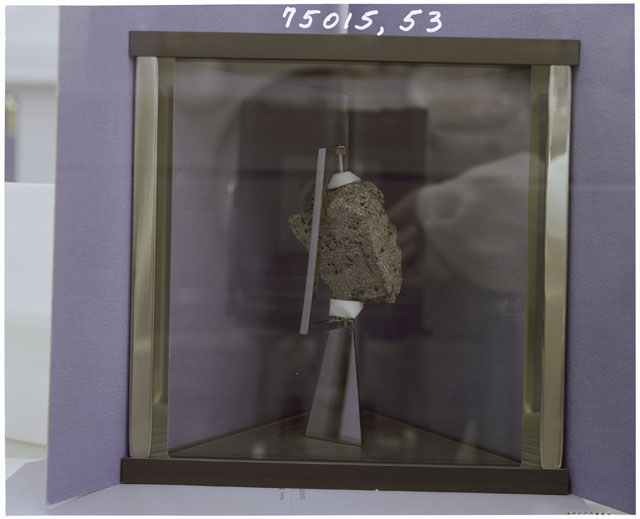 Color Processing photograph of Apollo 17 Sample(s) 75015,53 in a display case.